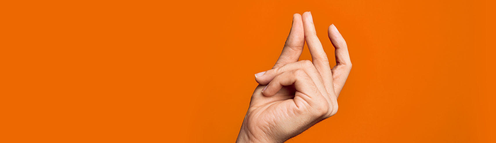 Orange background with a finger that's about to snap