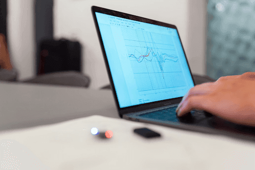 Close-up of a laptop displaying data-sharing challenges on the screen.