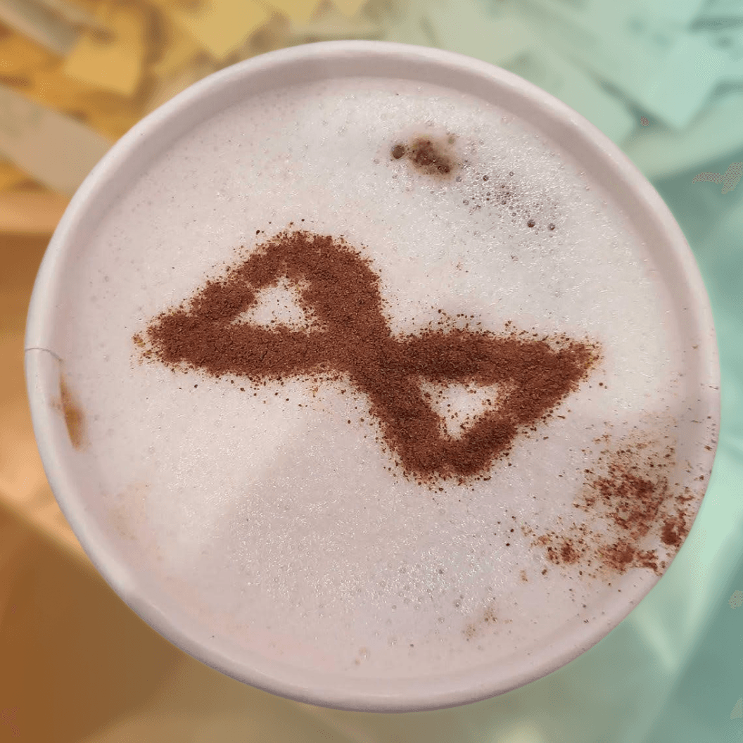 The Alation logomark in a latte