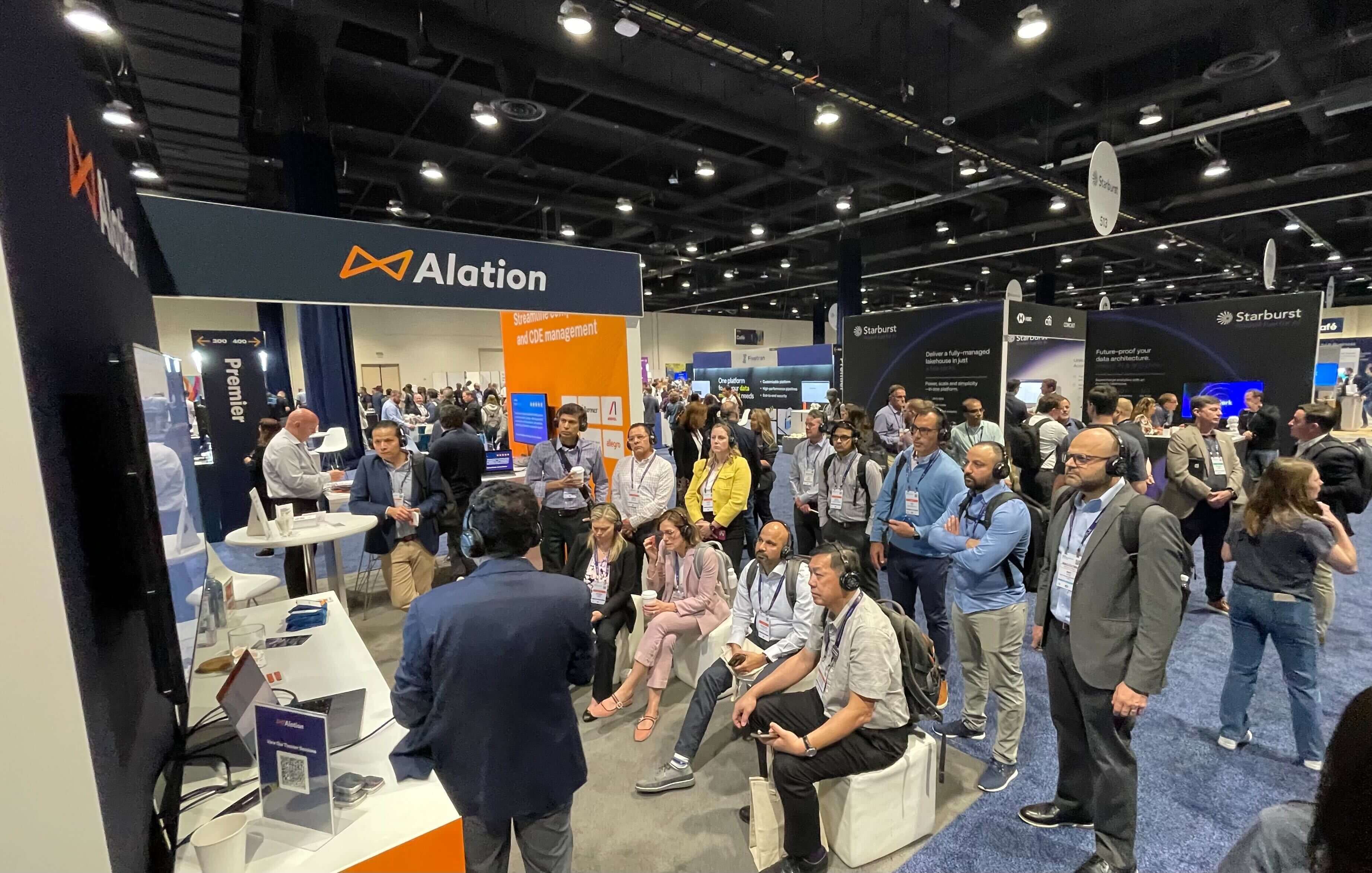 Alation hosting a group of attendees for an in-booth demo at Gartner Data & analytics summit 2025