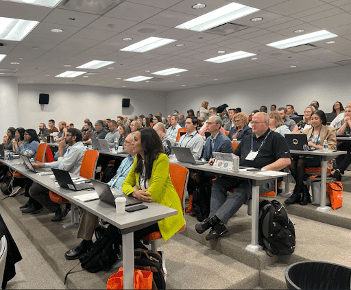 Candid moment capturing the diverse and engaged participants at the revAlation event