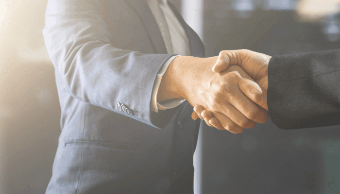 Alation Blog Image: Two people shaking hands