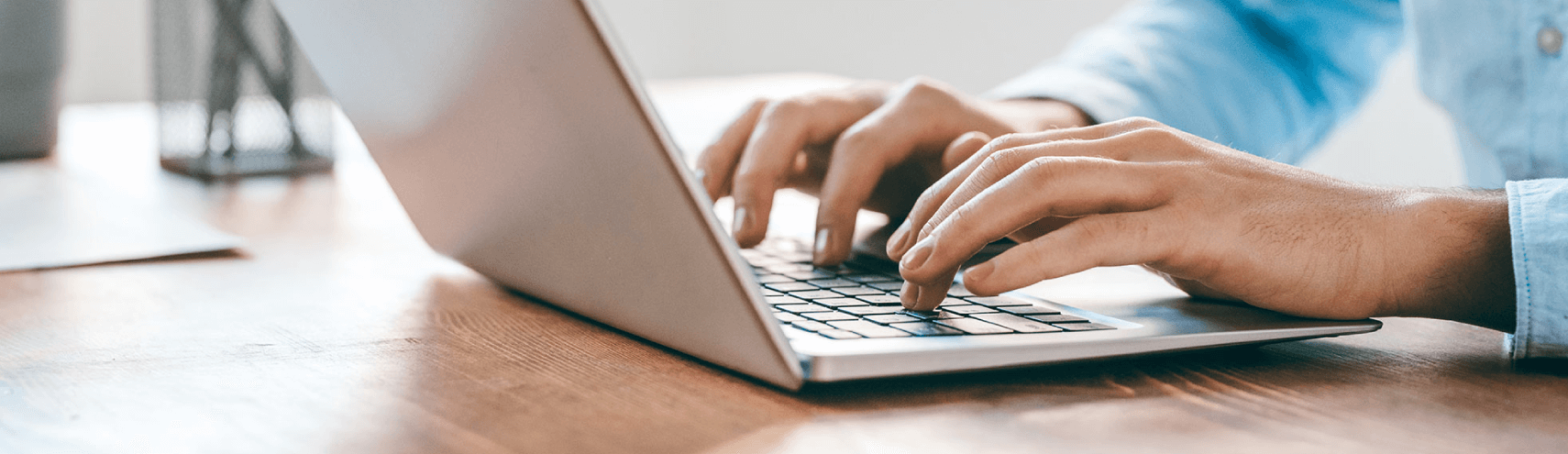 Alation Blog Image: Opened laptop with someone typing.