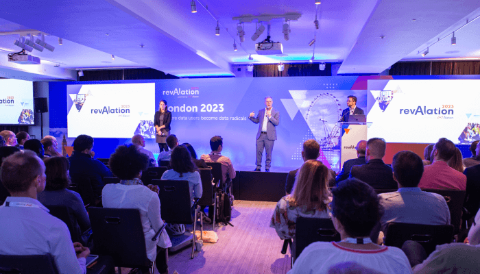 Alation product image: Diverse group of engaged attendees networking and enjoying the revAlation Sydney 2023 event, showcasing the theme "Empowering a Brighter Future."