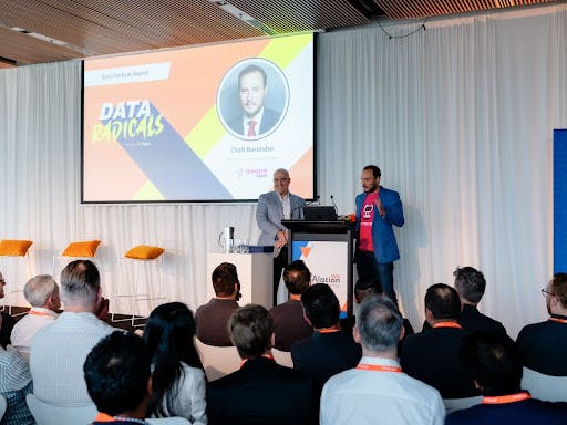 Chad Barendse, Data Governance Manager at Aware Super, receiving the prestigious Data Radicals Award at revAlation Sydney 2023.
