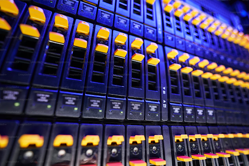 Close-up view of server rack panels with yellow and red LED lights on.