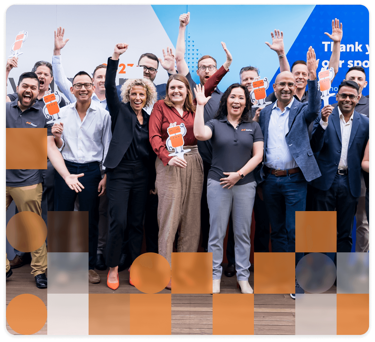 Enthusiastic Alationauths celebrating with raised arms, holding Allie mascot cutouts against blue background.