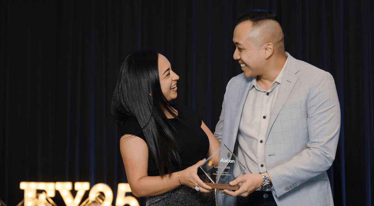 Alation Blog Image: Two people accepting an award