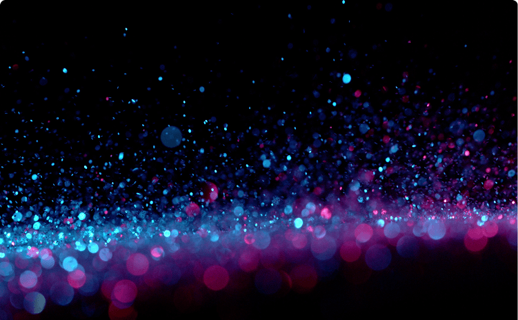 Abstract bokeh background with glowing blue and pink particles scattered against a dark black backdrop.