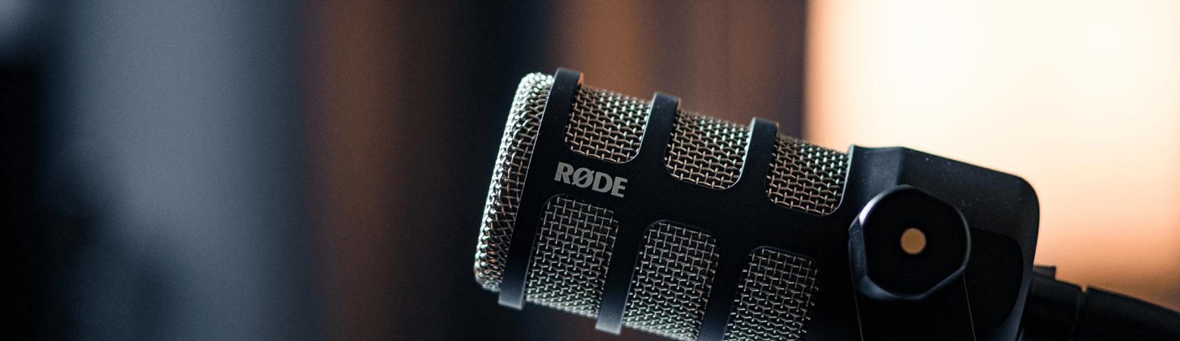 A zoomed in shot of a Rode podcast microphone