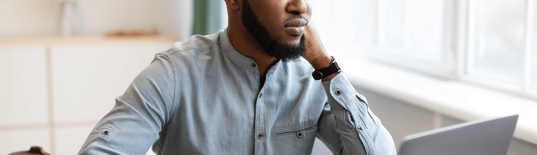 A confused data catalog user looking into their laptop computer while working from home