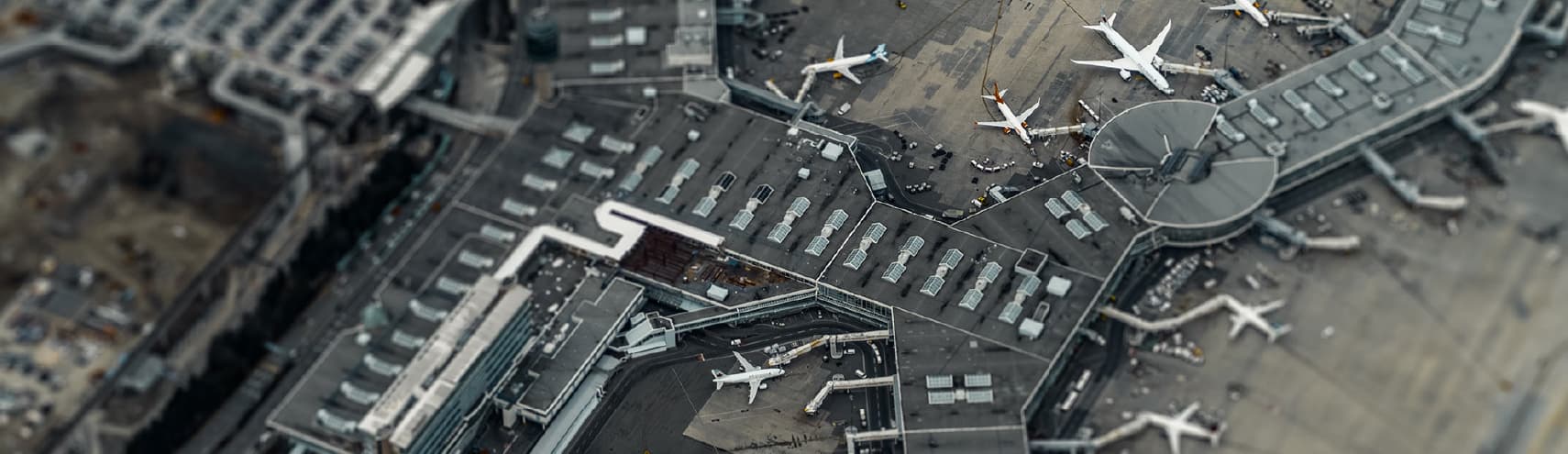 Aerial view of a large airport with long runways to provide an example of data analytics in the travel industry