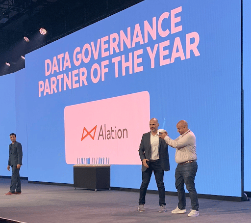 Alation receiving the Snowflake Data Governance Partner of the Year award for 2022 in Snowflake Summit 2022